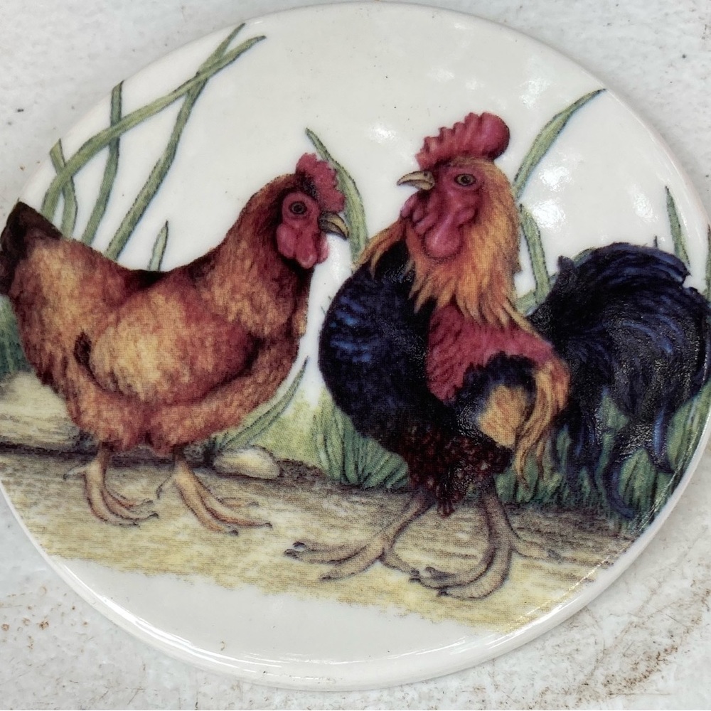 Beautiful rooster and wifey on a beautiful delicate plate